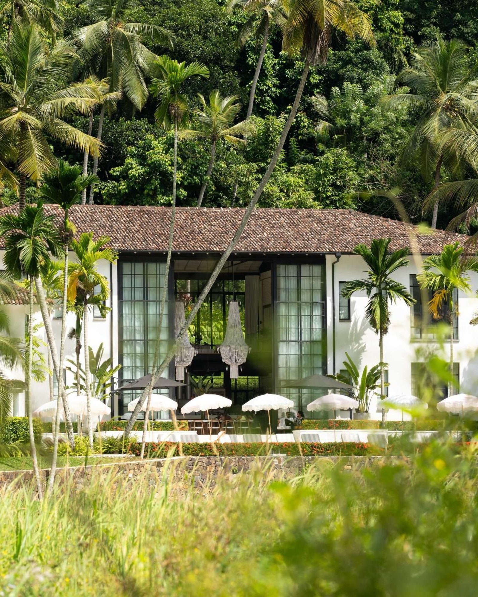 The hotel facade seen across the rice field