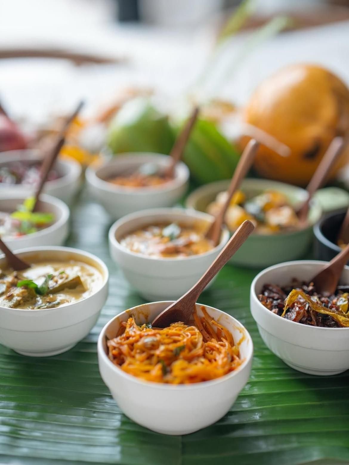 Bowls of Sri Lankan curry on banana leaf