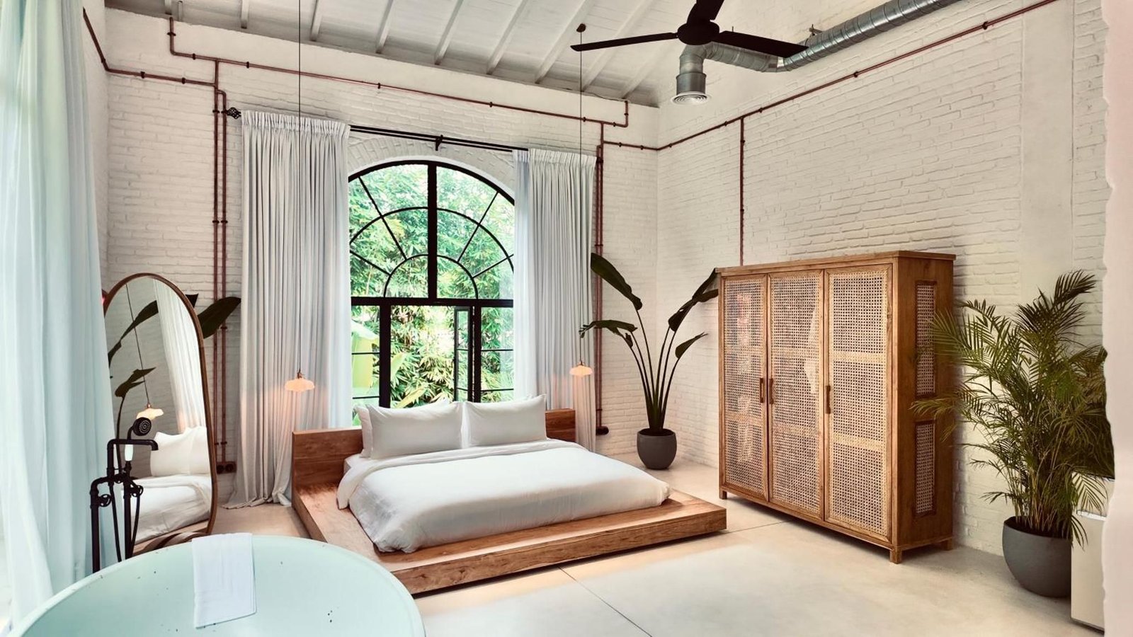 King bed on a low teak platform