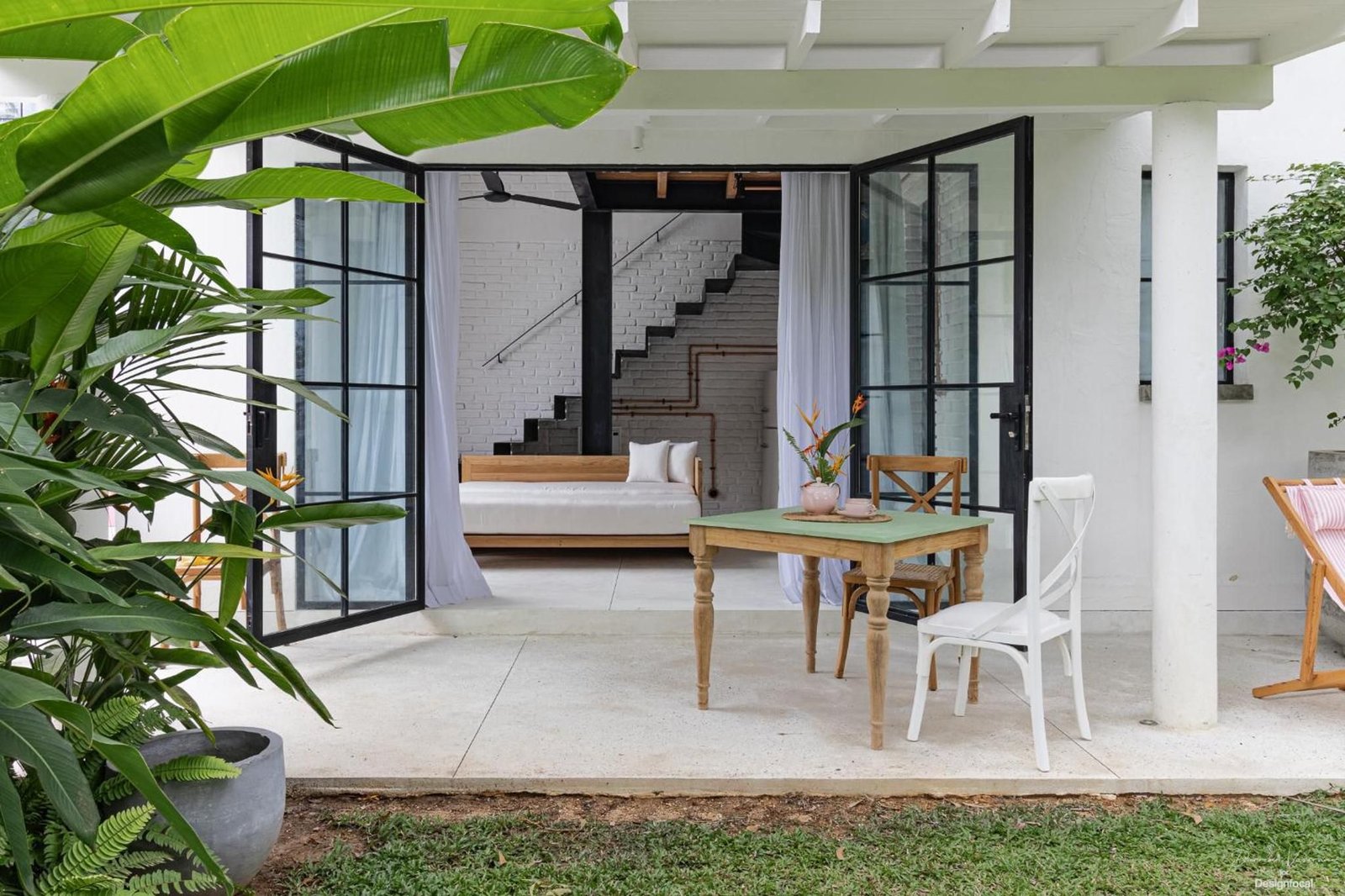 A loft veranda opening onto the garden