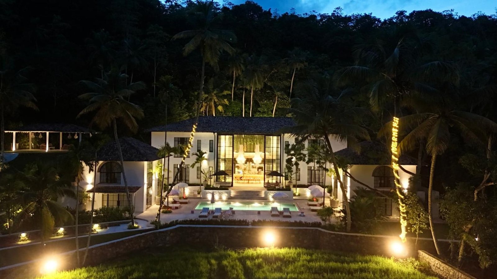 The estate glowing at blue hour